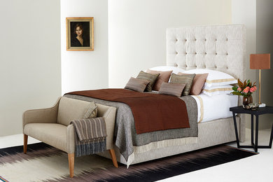 Design ideas for a large contemporary master bedroom in London with white walls and carpet.