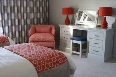Inspiration for a modern guest bedroom in Devon with grey walls, carpet and grey floors.