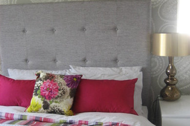Photo of a contemporary grey and pink bedroom in Surrey.