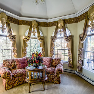 Design ideas for a large victorian master bedroom in New York with beige walls, carpet, no fireplace and brown floor.