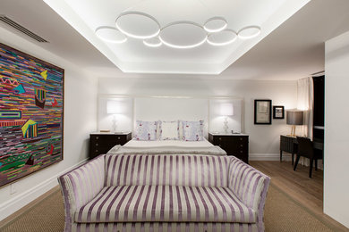 Example of a large trendy master light wood floor bedroom design in Toronto with white walls