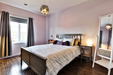 Inspiration for a mid-sized contemporary master medium tone wood floor bedroom remodel in Montreal with purple walls