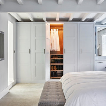 Contemporary bedroom and adjoining dressing room by The Secret Drawer, Yorkshire