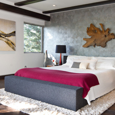 Inspiration for a large contemporary master dark wood floor and brown floor bedroom remodel in Los Angeles with gray walls and no fireplace