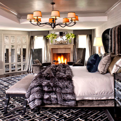 Trendy bedroom photo in Los Angeles with gray walls and a standard fireplace