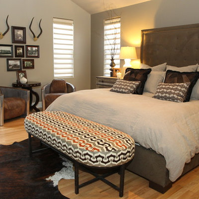 Trendy medium tone wood floor bedroom photo in St Louis with gray walls