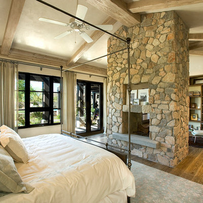 Example of a trendy bedroom design in Phoenix with a standard fireplace