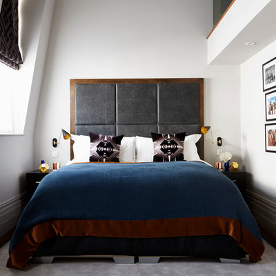 Trendy carpeted bedroom photo in London with white walls