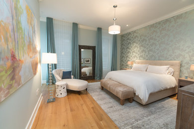 Bedroom - contemporary master light wood floor bedroom idea in New York with blue walls