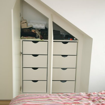 Contemporary fitted wardrobes for loft bedroom in London, UK