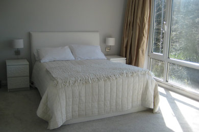 This is an example of a contemporary bedroom in Cambridgeshire.