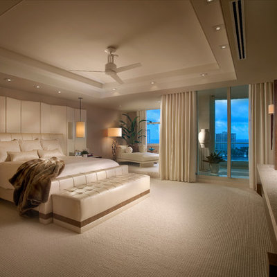 Trendy master carpeted bedroom photo in Miami with no fireplace and gray walls