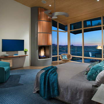 Contemporary teal accented bedroom with contemporary ceiling fan in Carefree, AZ