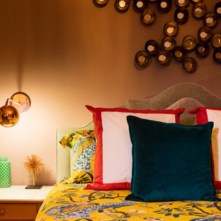 Example of a mid-sized transitional bedroom design in Orange County