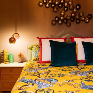 Example of a mid-sized eclectic bedroom design in Orange County