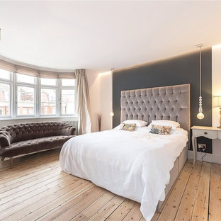 Design ideas for a medium sized vintage bedroom in Other with white walls, light hardwood flooring and beige floors.