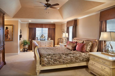 Large elegant master carpeted bedroom photo in Philadelphia with beige walls