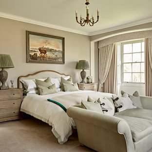 Photo of a medium sized classic bedroom in London with beige walls, carpet and beige floors.