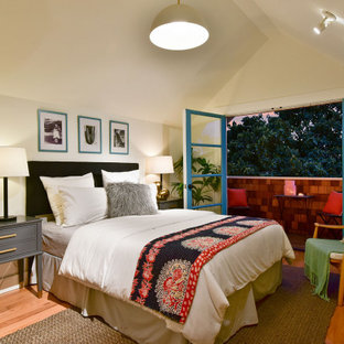 Bedroom - transitional medium tone wood floor, brown floor and vaulted ceiling bedroom idea in San Francisco with beige walls