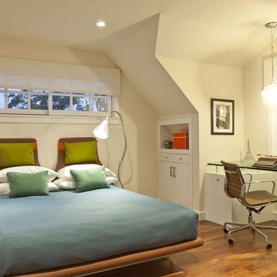 Bedroom - eclectic medium tone wood floor bedroom idea in Los Angeles with beige walls