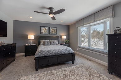 Inspiration for a mid-sized transitional master carpeted and gray floor bedroom remodel in Chicago with gray walls