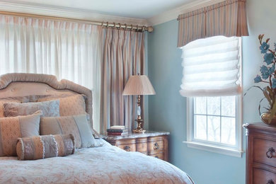 Medium sized classic master bedroom in Philadelphia with blue walls and dark hardwood flooring.