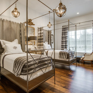 Example of a tuscan dark wood floor bedroom design in Dallas with white walls