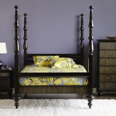 Example of an eclectic dark wood floor bedroom design in Other with purple walls