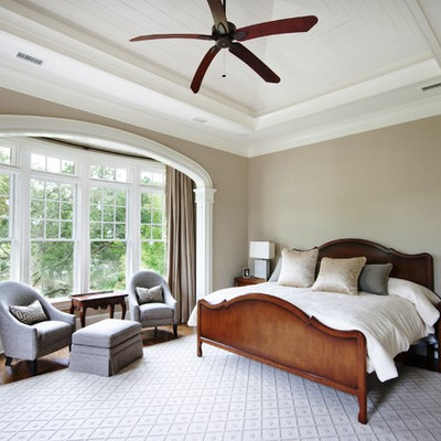 Inspiration for a timeless bedroom remodel in Charleston with beige walls