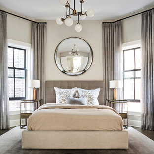 Inspiration for a mid-sized transitional guest dark wood floor and beige floor bedroom remodel in Chicago with beige walls and no fireplace