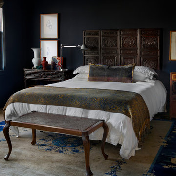 Dark blue guest bedroom with Asian-inspired accents