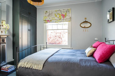 Inspiration for an eclectic grey and pink bedroom in London.