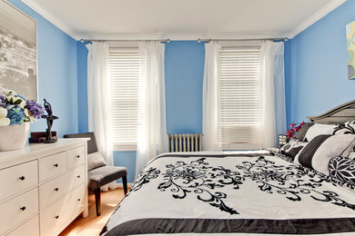 Elegant bedroom photo in DC Metro with blue walls