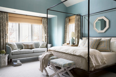 Example of a transitional bedroom design in Boston with blue walls