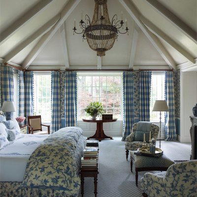 Large elegant master carpeted bedroom photo in New York with blue walls