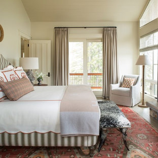Bedroom - rustic master bedroom idea in Seattle with beige walls, a standard fireplace and a stone fireplace