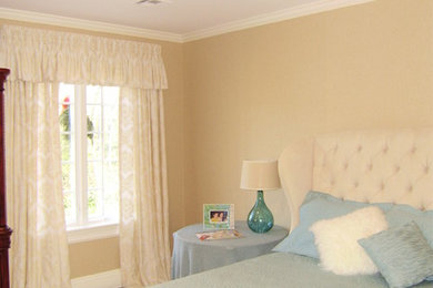 Example of a mid-sized transitional carpeted bedroom design in Boston with beige walls and no fireplace