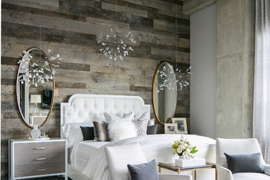Example of a large urban master medium tone wood floor and gray floor bedroom design in Denver with gray walls and no fireplace
