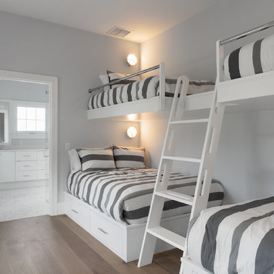 Bedroom - large coastal guest light wood floor bedroom idea in Boston with gray walls and no fireplace