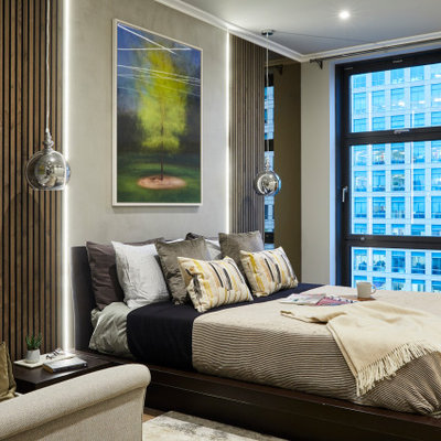 Large trendy master brown floor bedroom photo in London with gray walls