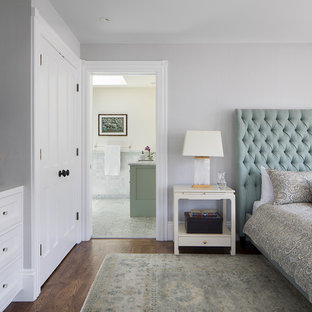 Photo of a large victorian master bedroom in San Francisco with grey walls, dark hardwood floors, no fireplace and brown floor.