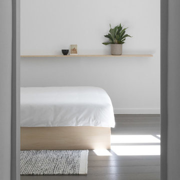 Doorway leading into a Minimal Japanese Style White Bedroom