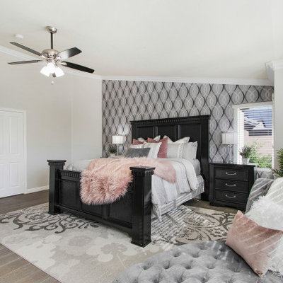 Example of a large transitional master light wood floor and beige floor bedroom design in Los Angeles with beige walls