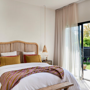 This is an example of a mid-sized contemporary master bedroom in Geelong with white walls, carpet, no fireplace and white floor.