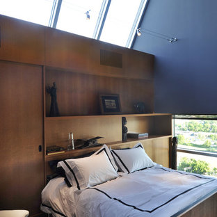 Foto de dormitorio tipo loft, contemporáneo, sin chimenea, con paredes azules