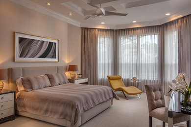 Inspiration for a large transitional master carpeted and beige floor bedroom remodel in Orlando with beige walls