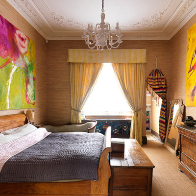 Inspiration for an eclectic carpeted bedroom remodel in London with brown walls