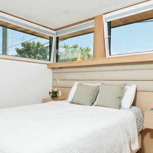 Photo of a scandinavian bedroom in Vancouver with white walls.