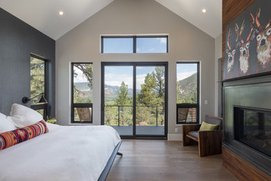 Bedroom - industrial bedroom idea in Denver