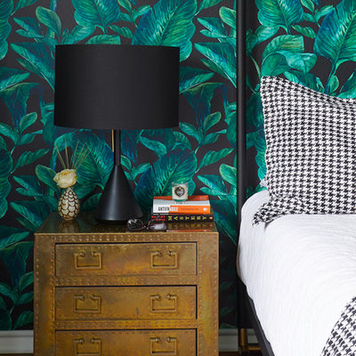 Bedroom - mid-sized eclectic master medium tone wood floor and brown floor bedroom idea in Austin with multicolored walls